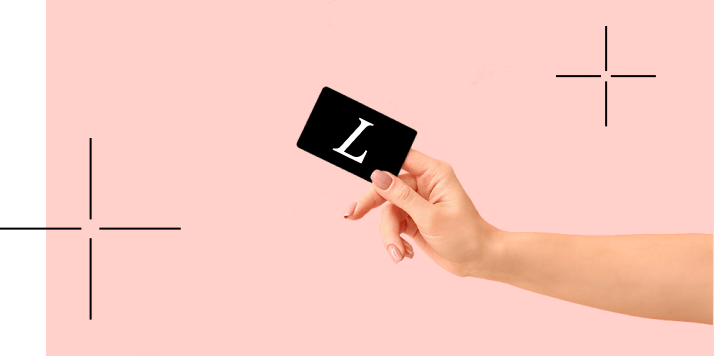 Online-store-1 An arm holding a card with a white Lumenis logo representing Lumenis+ Membership Rewards